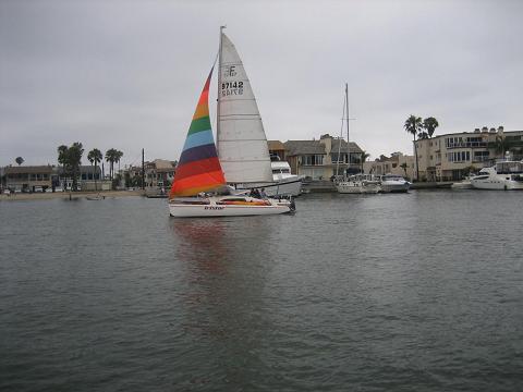 Lovely color small boat in a tour in new port beach.