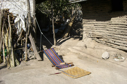 Weaving station outside couple's home.