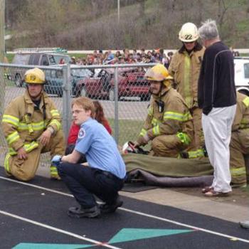 <b>My son (in blue) waiting for Medlink helicopter, Linda from Minnesota</b>