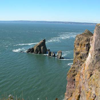 <b>The tide coming in around Cape Split at the entrance to Minas Basin, NS, Canada.</b> <b>The tide coming in around Cape Split at the entrance to Minas Basin, NS, Canada.</b>