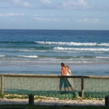 <b>Matt and Nicole walking along the beach at Rainbow Bay.</b>
